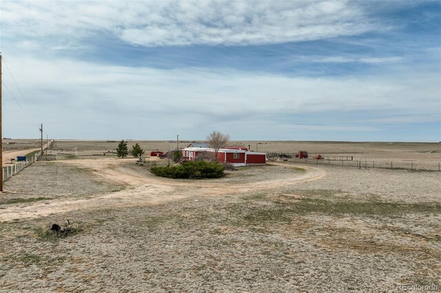 41215 Alta Vista Rd, Ramah, CO 80832 - view of yard featuring a rural view, fence, an outbuilding, and a pole building