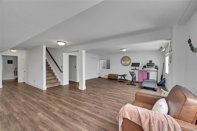 215 Mcafee Cir, Erie, CO 80516 - living room with stairs and wood finished floors