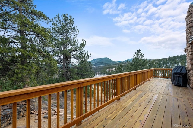 wooden terrace with a mountain view