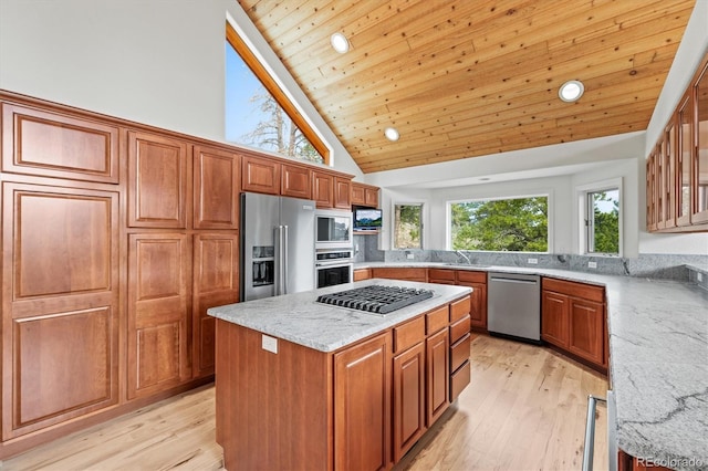 kitchen featuring light wood-type flooring, light stone counters, wooden ceiling, stainless steel appliances, and a sink