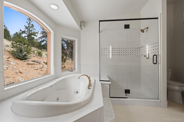 bathroom with toilet, a tub with jets, a shower stall, and tile patterned flooring