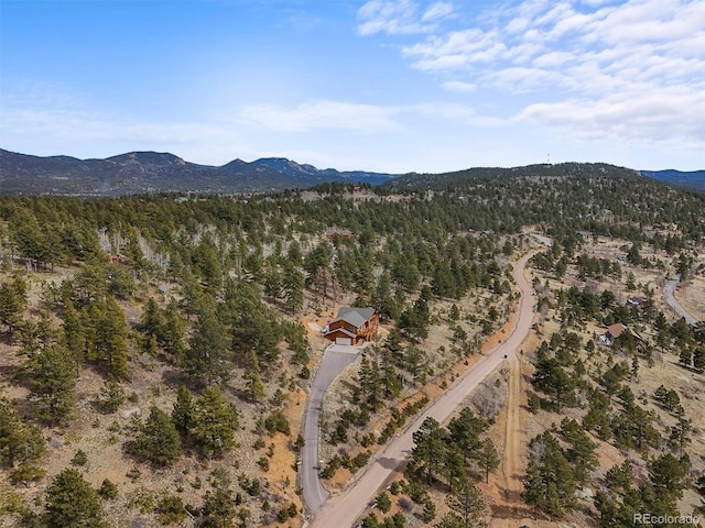 bird's eye view with a wooded view and a mountain view