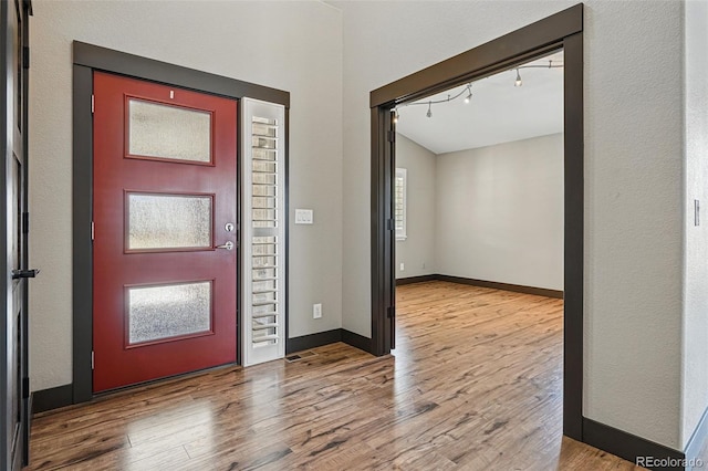 19423 W 52nd Dr, Golden, CO 80403 - entryway with baseboards, wood finished floors, and track lighting