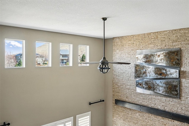 19423 W 52nd Dr, Golden, CO 80403 - room details with ceiling fan and a textured ceiling
