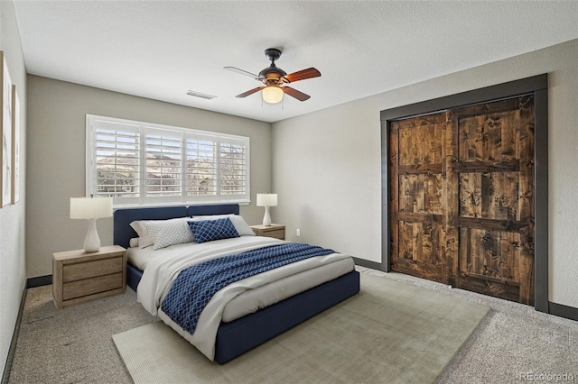 19423 W 52nd Dr, Golden, CO 80403 - carpeted bedroom featuring baseboards, visible vents, a textured ceiling, and a ceiling fan