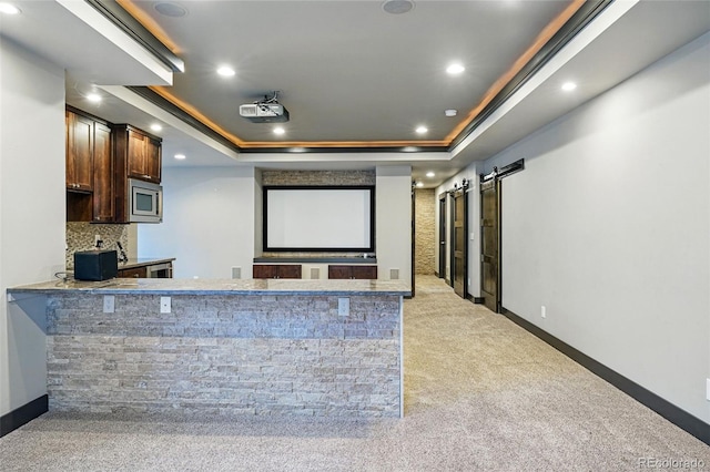 19423 W 52nd Dr, Golden, CO 80403 - carpeted home theater room featuring a tray ceiling, baseboards, and recessed lighting