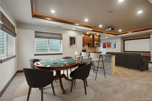 19423 W 52nd Dr, Golden, CO 80403 - playroom with bar area, recessed lighting, baseboards, a raised ceiling, and light carpet