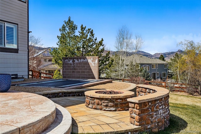 19423 W 52nd Dr, Golden, CO 80403 - view of patio featuring a fire pit and a mountain view
