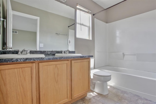 245 Homestead Way, Brighton, CO 80601 - bathroom featuring double vanity, bathing tub / shower combination, and tile patterned flooring