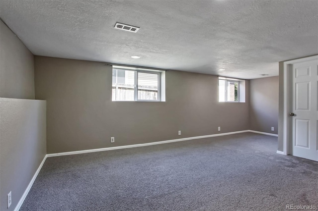 245 Homestead Way, Brighton, CO 80601 - basement featuring a textured ceiling and carpet flooring