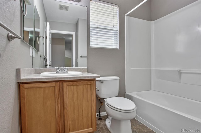 245 Homestead Way, Brighton, CO 80601 - full bath featuring vanity, washtub / shower combination, a textured wall, and tile patterned flooring