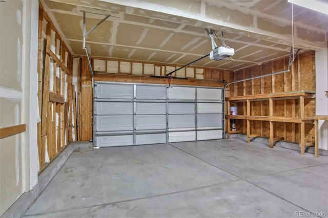 245 Homestead Way, Brighton, CO 80601 - garage featuring a garage door opener