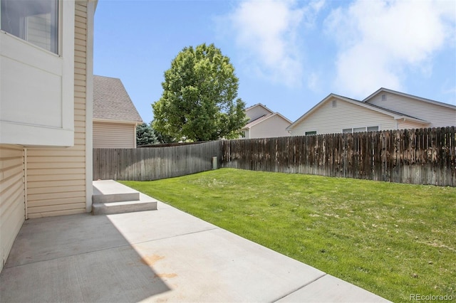 245 Homestead Way, Brighton, CO 80601 - fenced backyard with a patio