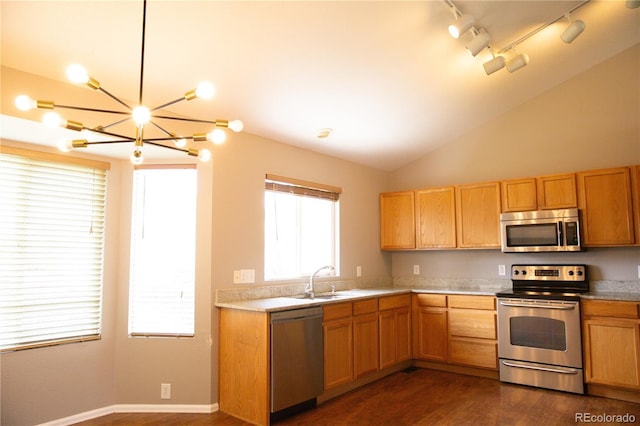 245 Homestead Way, Brighton, CO 80601 - kitchen featuring appliances with stainless steel finishes, a chandelier, light countertops, dark wood-style flooring, and lofted ceiling