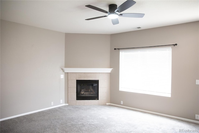245 Homestead Way, Brighton, CO 80601 - unfurnished living room featuring a ceiling fan, carpet flooring, and a tile fireplace