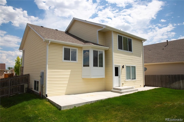 245 Homestead Way, Brighton, CO 80601 - back of house featuring a patio and a shingled roof