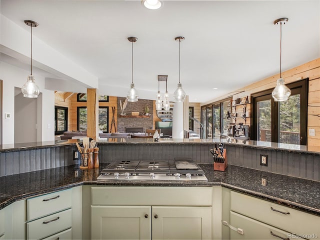 24 Pine Valley Rd, Evergreen, CO 80439 - kitchen featuring stainless steel gas stovetop, plenty of natural light, a fireplace, and open floor plan