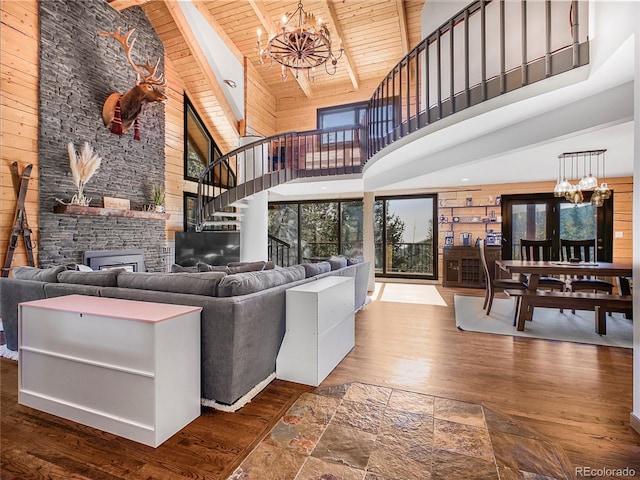 24 Pine Valley Rd, Evergreen, CO 80439 - living area featuring wooden ceiling, high vaulted ceiling, stairway, and a chandelier