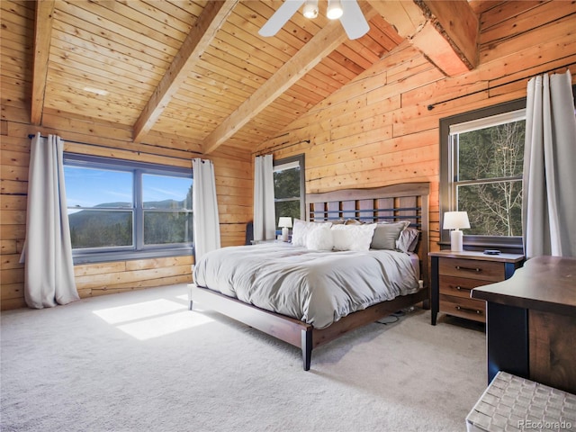 24 Pine Valley Rd, Evergreen, CO 80439 - carpeted bedroom featuring wood walls, lofted ceiling with beams, multiple windows, and wooden ceiling