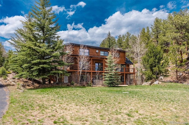 24 Pine Valley Rd, Evergreen, CO 80439 - rear view of house featuring a lawn and a wooden deck
