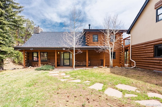 24 Pine Valley Rd, Evergreen, CO 80439 - rear view of house with a porch, a yard, and log siding