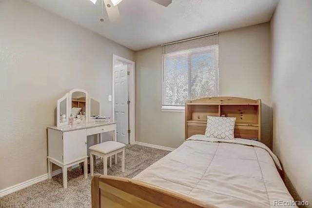 carpeted bedroom with baseboards and a ceiling fan