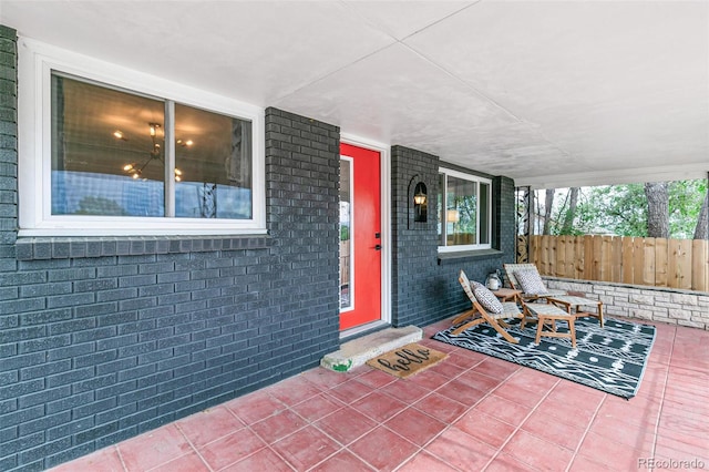 property entrance featuring a porch