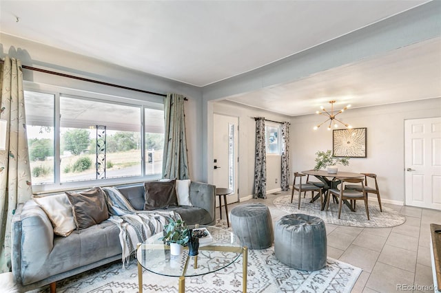 living room with an inviting chandelier, light tile patterned floors, and a healthy amount of sunlight