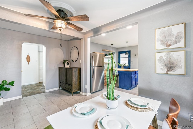 dining room featuring ceiling fan and light tile patterned floors