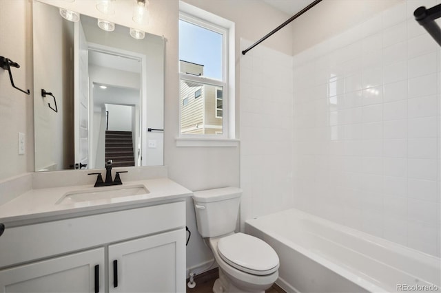 full bathroom with vanity, toilet, and tiled shower / bath combo