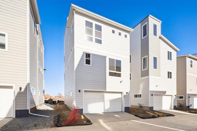 back of property featuring a garage