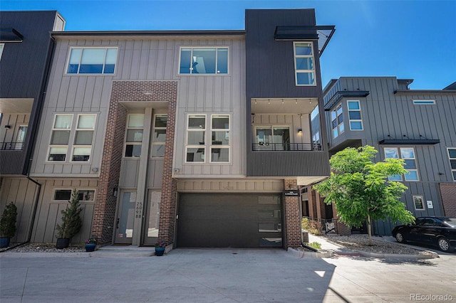 5018 S Prince Pl, Littleton, CO 80123 - view of front facade with driveway and an attached garage