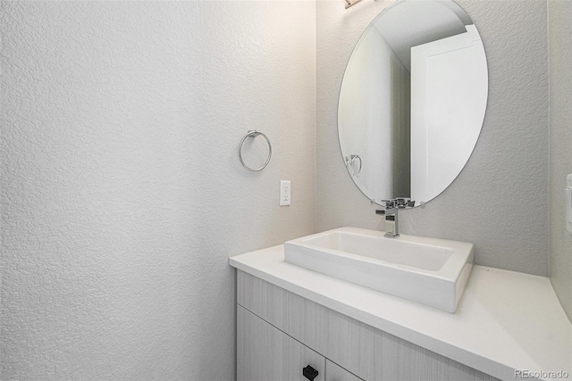 5018 S Prince Pl, Littleton, CO 80123 - bathroom with a textured wall and vanity