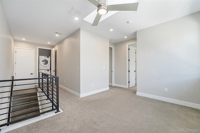 5018 S Prince Pl, Littleton, CO 80123 - spare room featuring stacked washing machine and dryer, a ceiling fan, recessed lighting, carpet flooring, and a smoke detector