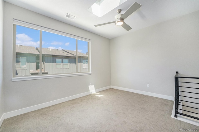 5018 S Prince Pl, Littleton, CO 80123 - carpeted empty room with a skylight and a ceiling fan