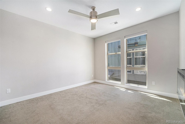 5018 S Prince Pl, Littleton, CO 80123 - carpeted spare room featuring ceiling fan and recessed lighting