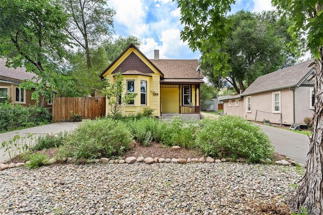 1318 S 25th St, Colorado Springs, CO 80904 - victorian house with a porch, a chimney, and roof with shingles