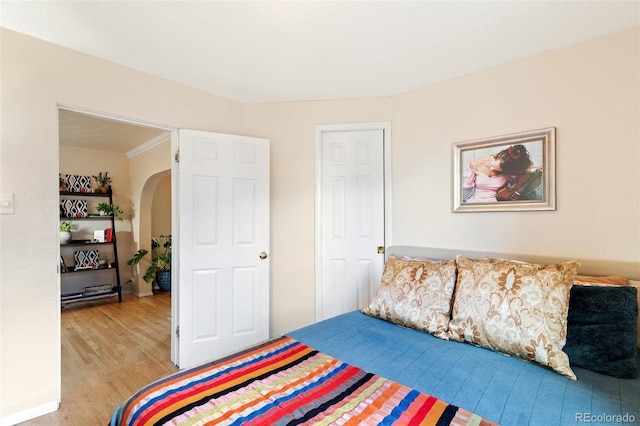 1318 S 25th St, Colorado Springs, CO 80904 - bedroom featuring light wood-style flooring and arched walkways