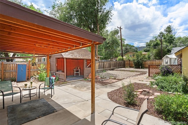 1318 S 25th St, Colorado Springs, CO 80904 - fenced backyard featuring a storage unit and a patio area