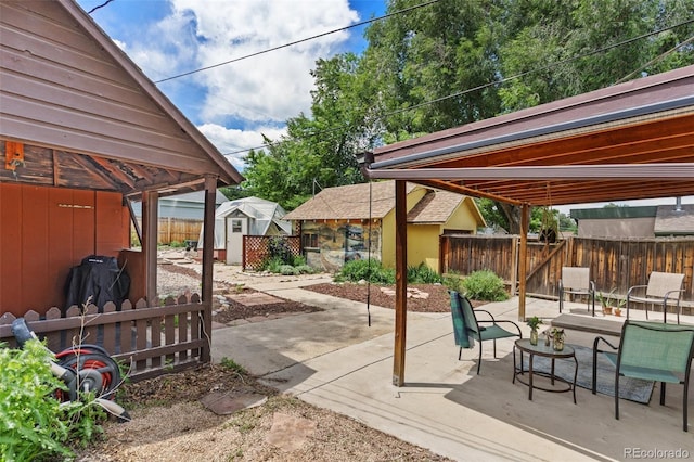 1318 S 25th St, Colorado Springs, CO 80904 - fenced backyard featuring a patio area and a storage shed