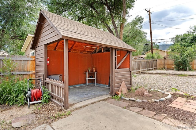 1318 S 25th St, Colorado Springs, CO 80904 - view of outbuilding with a fenced backyard
