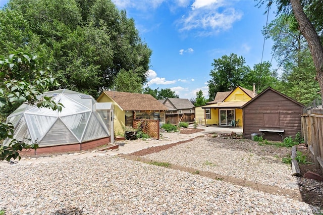 1318 S 25th St, Colorado Springs, CO 80904 - view of yard with a greenhouse and an outdoor structure