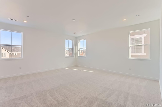 unfurnished room with light carpet