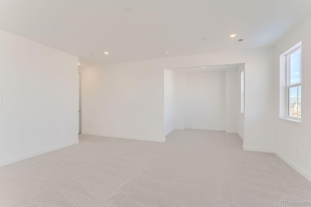 empty room with light colored carpet