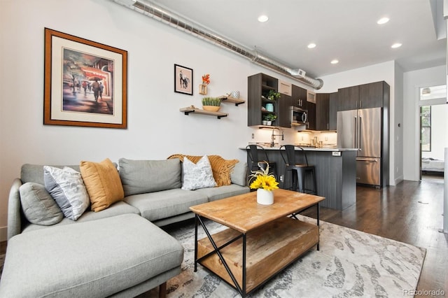 living room with dark hardwood / wood-style flooring