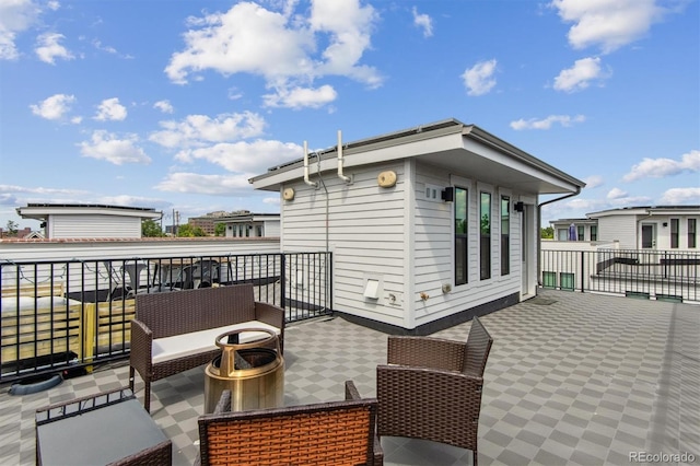 view of patio with a balcony and outdoor lounge area