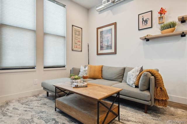 living room with hardwood / wood-style flooring and plenty of natural light