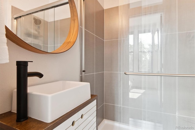 bathroom featuring a shower with door, vanity, and hardwood / wood-style floors