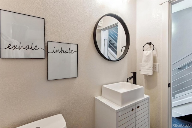 bathroom with vanity and toilet