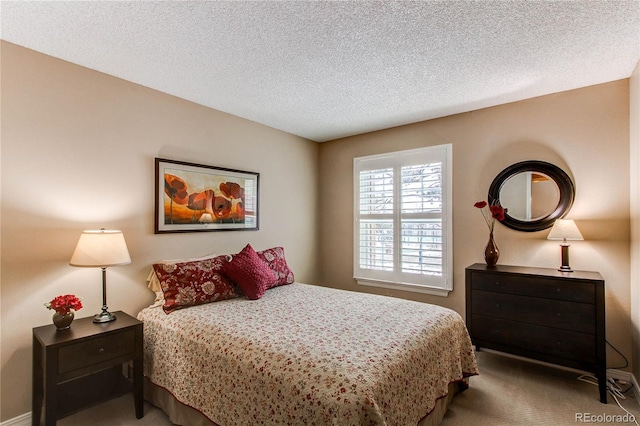 carpeted bedroom with a textured ceiling